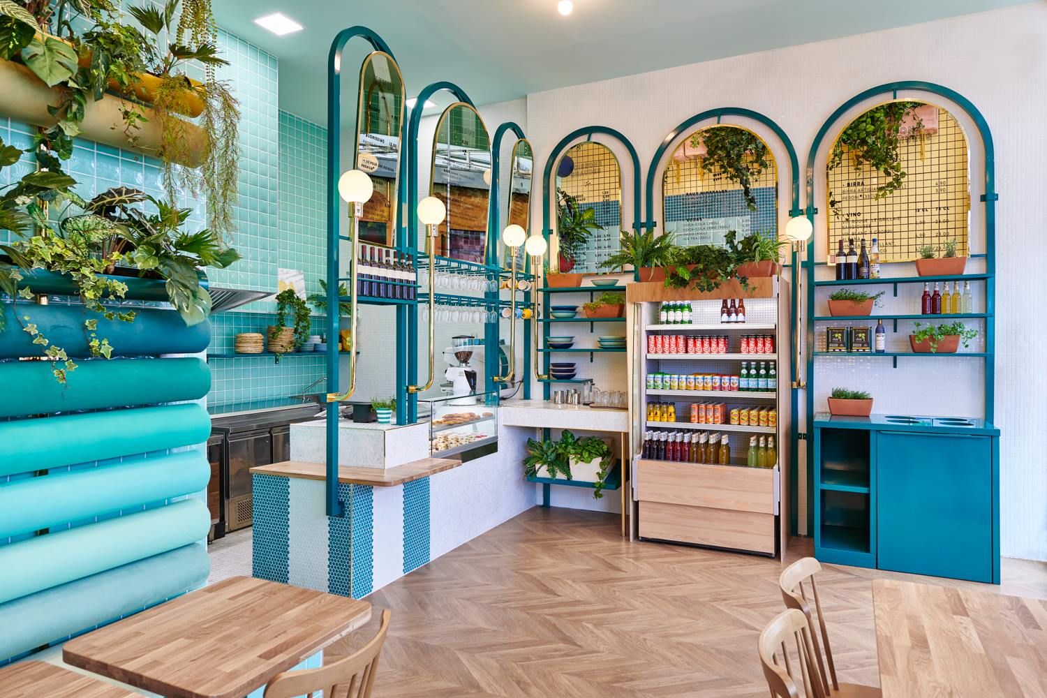 Concept food de piadine : comptoir carrelé, murale libre-service et décor végétal